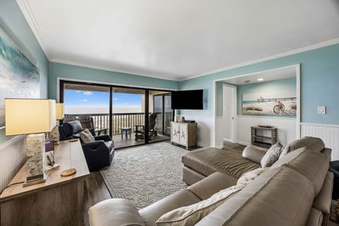 Oceanfront living room with comfy seating and amazing views!