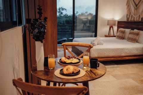 Deluxe Apartment, Balcony, City View | Dining room