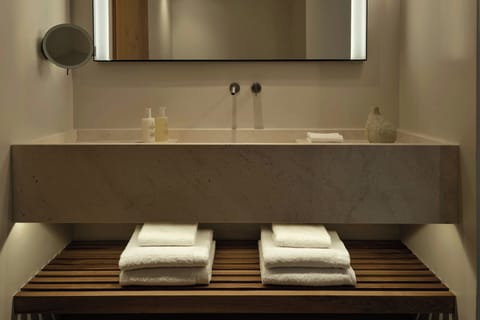 Eco-friendly toiletries, hair dryer, bathrobes, slippers