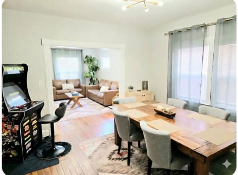 Large, custom dining table and arcade for game night with family or friends