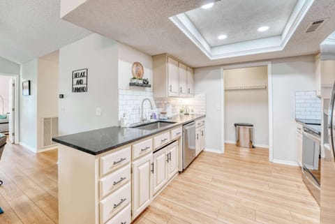 A sun-drenched kitchen, bathed in natural light, showcasing a blend of modern and rustic charm. A space for culinary creativity and cozy gatherings.