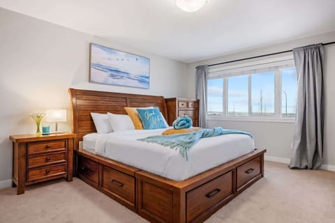 Warm wood, crisp white bedding, and a king bed that's impossible to leave.