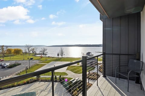 Enjoy outdoor relaxation with comfortable seating on the balcony.