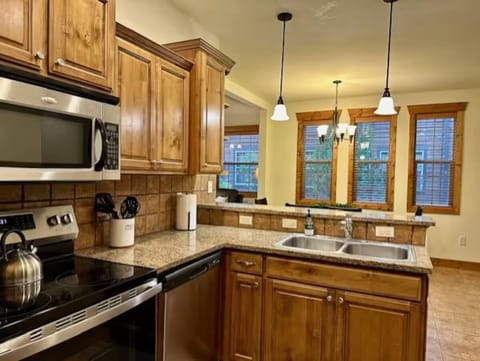 Full kitchen with new appliances: microwave, oven, dishwasher, fridge. 
