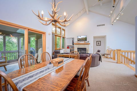 The dining room table comfortably seats 8 (as shown) and with leaves can seat 12