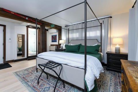 King canopy bed with memory foam mattress, perfect for a restful night’s sleep.