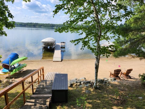 Short flight of stairs with handrail to lake