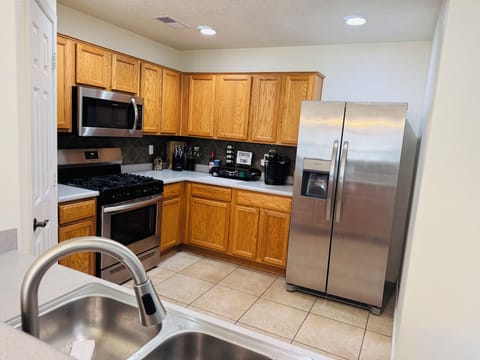Fully equipped kitchen, feel free to open the cabinets & peek inside the pantry.