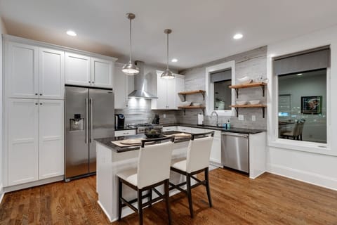 Enjoy a stylish kitchen complete with a central island that seats two, perfect for cooking, dining, or entertaining