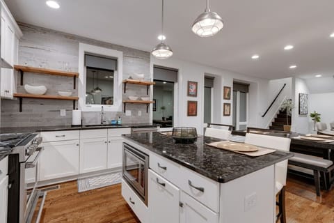 Enjoy a stylish kitchen complete with a central island that seats two, perfect for cooking, dining, or entertaining