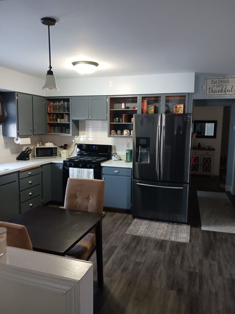 Full kitchen with dishes, pans, silverware.  Refrigerator dispenses water, ice.