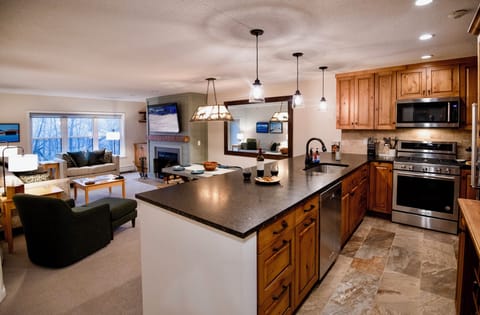 Large kitchen island allows for additional eating and serving space.