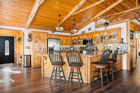 Bar seating for up to four at the kitchen island.