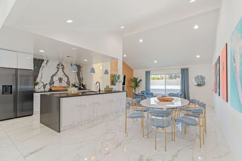 Modern kitchen & dining area w/ clean lines, island seating, and an open flow for shared meals.