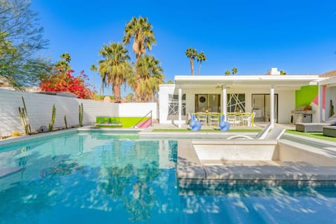 Sun-soaked backyard pool w/ loungers & palm views, perfect for cooling off and relaxing under the desert sky.