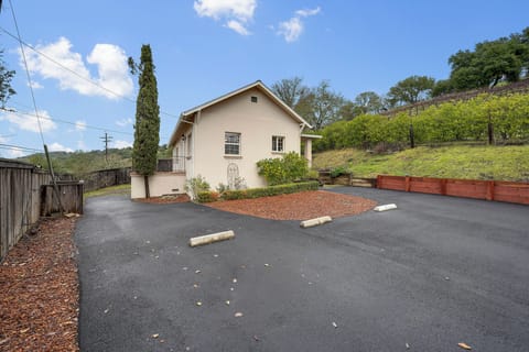 View of the house front from inside portion of the driveway.