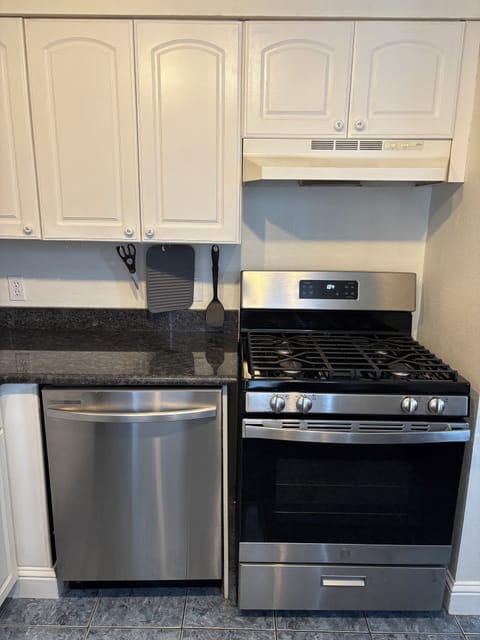 Full size dishwasher, oven, and stove. 