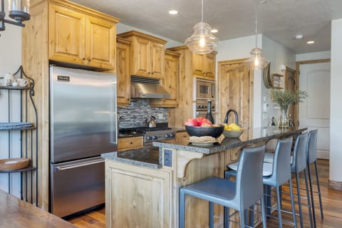 Barstool seating at the kitchen counter.