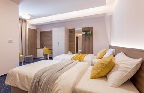 Superior Twin Room, City View | Minibar, desk, laptop workspace, soundproofing