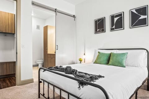 The bedroom offers a luxurious retreat, with a bed that promises restful nights and a room that feels like a private oasis.