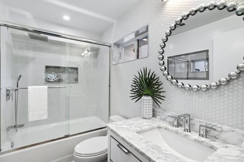 Bathroom featuring shower tub combo