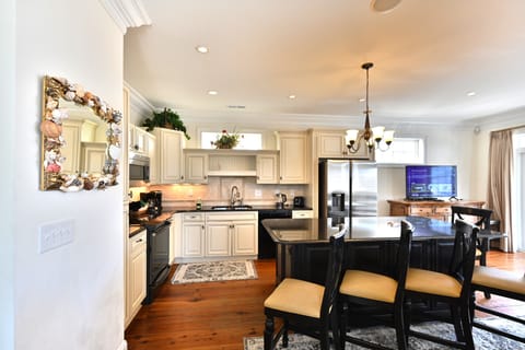 Spacious kitchen with bar seating and open modern layout
