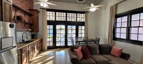 large bay doors converted into windows offers lots of light.