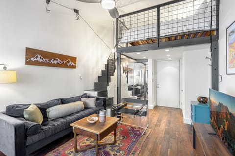Welcome to Tomboy Lodge 144. Spacious studio with Queen bed, closet for storage, high ceilings, and modern style.