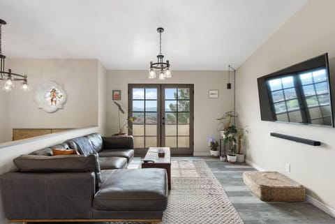 Main living room with 75" smart TV and Sonos sound