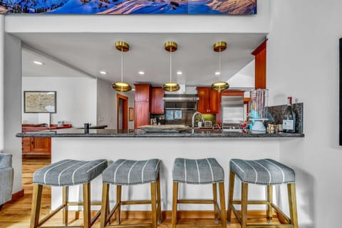 Kitchen: Drip coffee maker, Nespresso, Crockpot, blender, stand mixer, 2 sinks, food-warming drawers, 9-burner stove with griddle, double oven, sub-zero fridge, cooking utensils, tableware