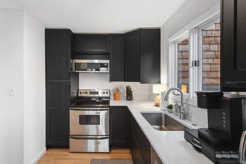 The kitchen is fully equipped with high-end appliances and all the cooking essentials you may need. Enjoy meals at the dining table.