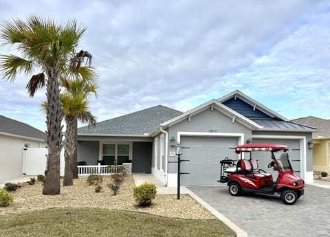 House Front with 4-Seater Golf Cart for Guest Use!
