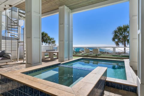 Dive into your private pool while soaking up stunning ocean views and Florida sunshine from this elevated terrace paradise.