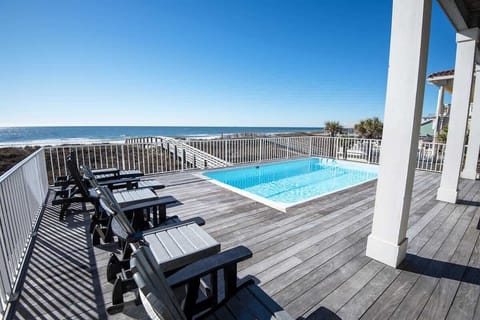 Gorgeous oceanfront pool with stunning views, perfect for relaxation. Enjoy alfresco dining under the stars, cozy up on plush lounge chairs, and soak in the beauty. A luxurious, serene escape where every moment feels peaceful and luxurious.