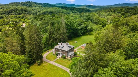 Private mountain retreat with expansive lawns and stunning forest views