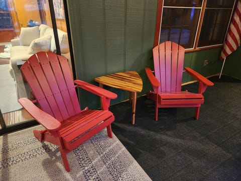 Screened in porch with a great view of the lake, perfect for morning coffee.