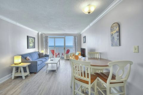 Let in the sun rays as you relax in the comfort of this living room with a view.