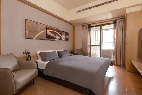 Bedroom Area:
• King Bed
• Closet
• 75" Smart TV
• Desk w/2 Office Chairs