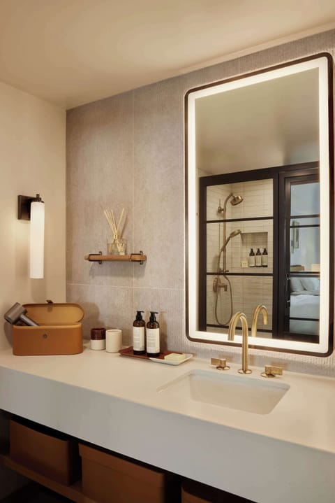 Combined shower/tub, designer toiletries, hair dryer, bathrobes