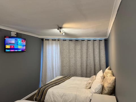 Family Triple Room, Patio, Pool View | Laptop workspace, iron/ironing board, free WiFi