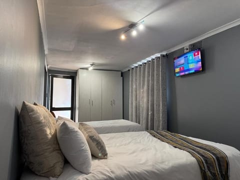 Family Triple Room, Patio, Pool View | Laptop workspace, iron/ironing board, free WiFi