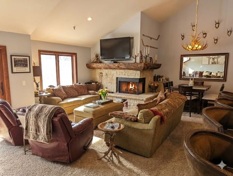 Relax in the cozy living room with a gas fireplace and plenty of seats for the entire group.