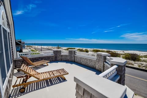 Stunning ocean views await you on this private balcony – perfect for lounging under the sun.