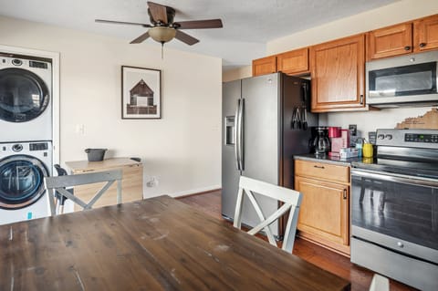 Stainless steel appliances and laundry area.