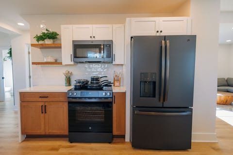 The large kitchen is located next to the living room so that no-one has to miss out on the fun!