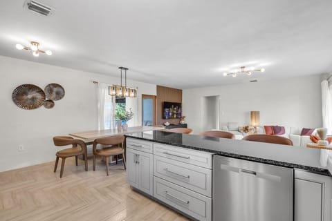 Gather 'round the island! Snacks and stories flow freely here.