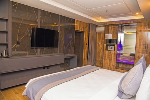 Premium Suite, 1 King Bed, Non Smoking, City View | In-room safe, desk, laptop workspace, iron/ironing board