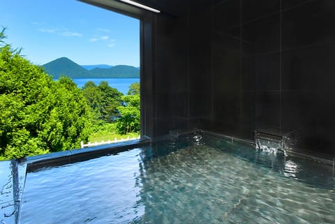 Deluxe Suite with Stone Onsen View Bath - Non-Smoking | Bathroom | Hair dryer, slippers, towels