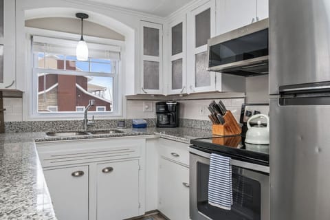 A well-stocked kitchen with ample counter space and a scenic view, ready for any culinary adventure.