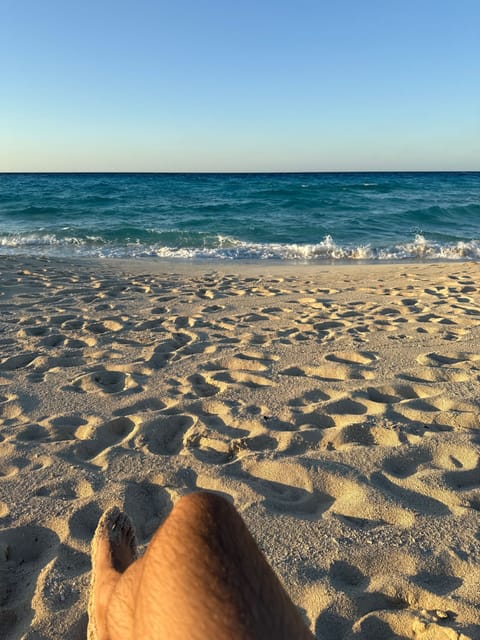 On the beach, white sand, beach towels
